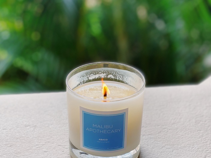 Clear Gloss x Blue Candle in the Abaco scent with notes of red currant