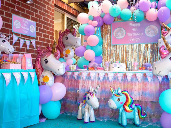 Photos from Paige's Unicorn themed 4th Birthday Party featuring our Magical Unicorn theme Personalised Party Decorations.